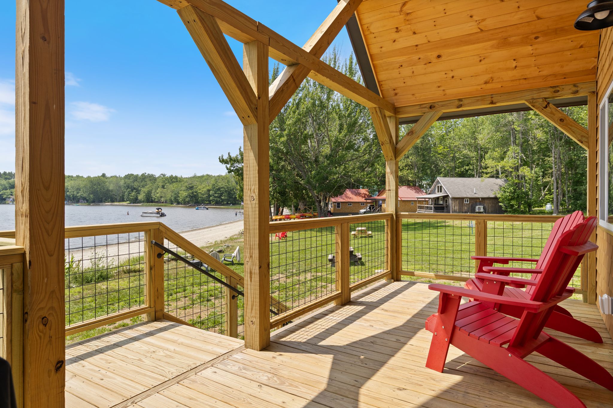 View from The Escape's deck across the yard and Lake Winnecook